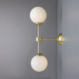 Yaounde double globe wall light | polished brass