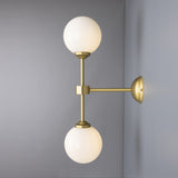Yaounde double globe wall light | polished brass