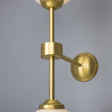 Yaounde double globe wall light | polished brass